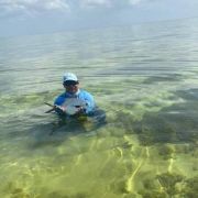 Happy angler with permit catch at Chetumal bay