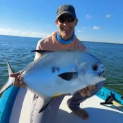 Happy angler with permit catch