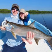 Happy Father and son with baby tarpoon catch