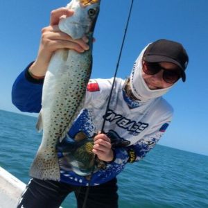 happy girl with sparkled trout Celestun