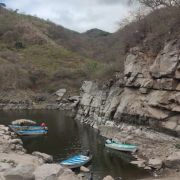 boats in a shore of Lake Aguamilpa