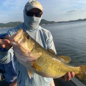 Angler with black bass catch