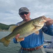 Angler with great black bass catch at Lake Baccarac