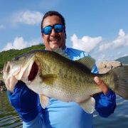 Happy angler with enormous bass catch at Mateos Lake