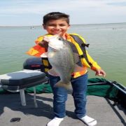 boy with great bass catch at Lake el Cuchillo