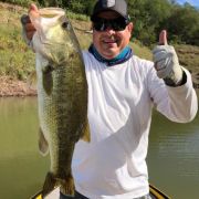 Happy Angler with amazing catch of a great black bass catch at lake Huites
