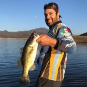 Angler with great black bass catch at Lake Baccarac