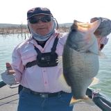 Happy and proud angler with blackbass catch at Lake el Cuchillo