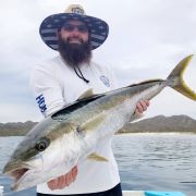 Proud angler with Baja yellowtail