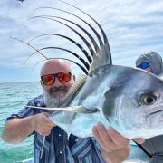 Happy angler showing off his roosterfish catch
