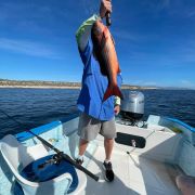 Angler showinf of his snappers catch in Bahía de los Sueños
