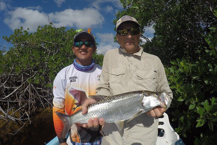 Angler with tarpon in Boca Paila