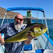 Angler proudly showing off his amazing Mahi Mahi Catch