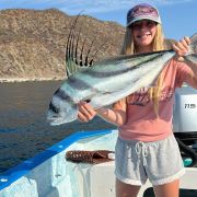 Little angler showing off her roosterfish catc at Ensenada de los Muertos