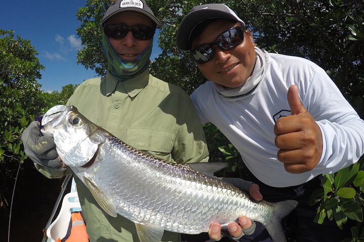 Angler fly fishing for tarpon